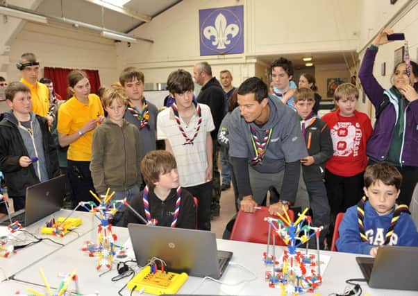 DIGITAL WORLD Bear Grylls meeting scouts at Ferny Crofts Activity Centre working on their technical skills