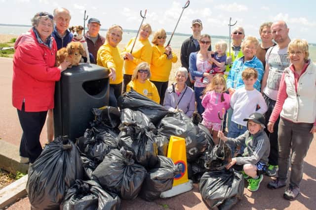 Volunteers at Stokes Bay in Gosport pick up rubbish and litter as they take part in the Round The Harbour Clean Up last year
