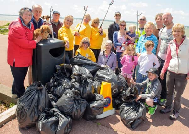 Volunteers at Stokes Bay in Gosport pick up rubbish and litter as they take part in the Round The Harbour Clean Up last year