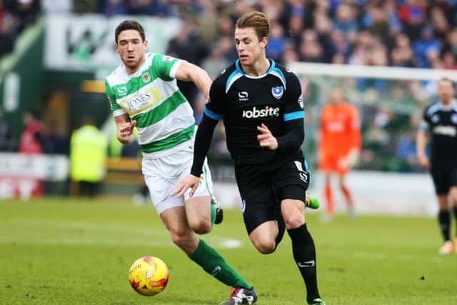 Pompey defender Adam Webster strides forward with purpose at Huish Park    Picture: Joe Pepler