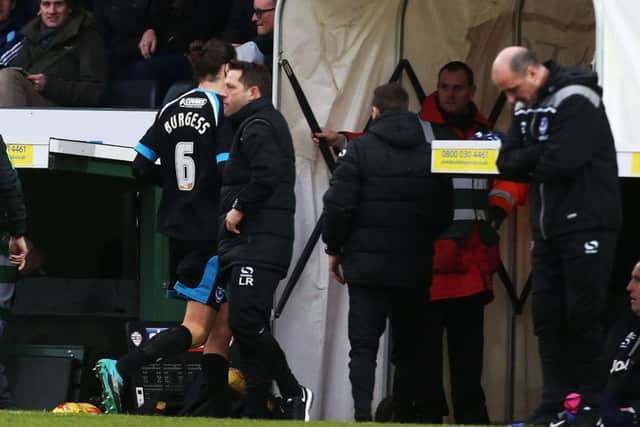 Christian Burgess leaves the field. Picture: Joe Pepler