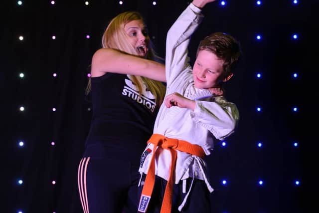 Harvey Griffiths, nine, demonstrates judo moves with the help of Sarah Smith of Same Difference at SD Studios in Portsmouth