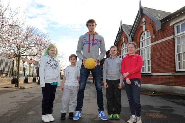 Team GB volleyball athlete Chris Gregory with children at Brockhurst Junior School in Gosport, from left, Lucy O'Rielly, Lewis Hicks and twins Daniel and Megan Walker Picture: Sarah Standing (160371-4188)