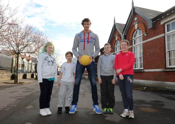 Team GB volleyball athlete Chris Gregory with children at Brockhurst Junior School in Gosport, from left, Lucy O'Rielly, Lewis Hicks and twins Daniel and Megan Walker Picture: Sarah Standing (160371-4188)