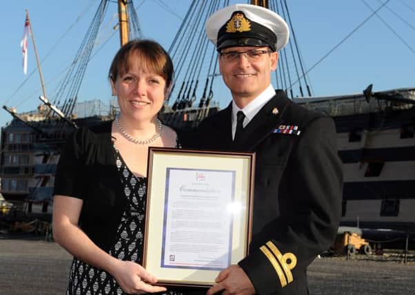 Lieutenant Adrian Gibson with his wife, after receiving the commendation. Picture: LA (Phot) Luron Wright