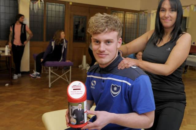 Pompey player Dory Yates gets a massage from event organiser Helena Murphy at the Walking with the Wounded  fundraiser Picture: Paul Jacobs (160141-5)