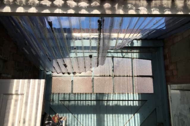 Damage to a roof in Kirby Road, Portsmouth, caused by a burglar fleeing police