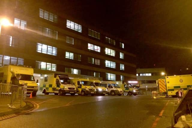 Ambulances queueing outside QA hospital on Monday - at most there were 16 waiting to discharge patients