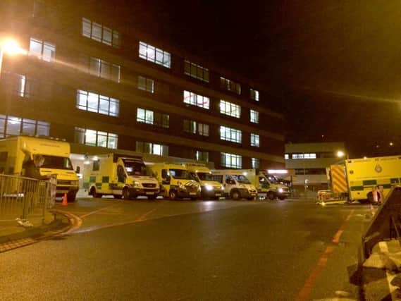Ambulances queueing outside QA hospital on Monday - at most there were 16 waiting to discharge patients