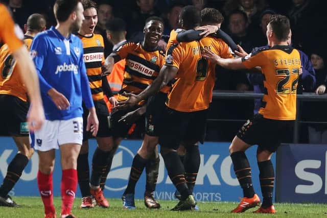 Barnet's John Akinde is congratulated after scoring the decisive goal against Pompey. Picture: Joe Pepler