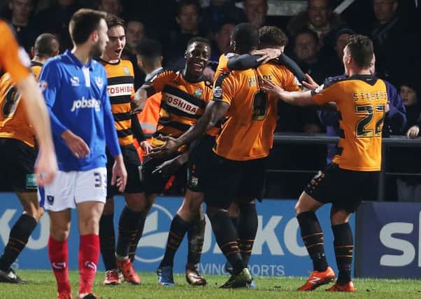 Barnet's John Akinde is congratulated after scoring the decisive goal against Pompey. Picture: Joe Pepler