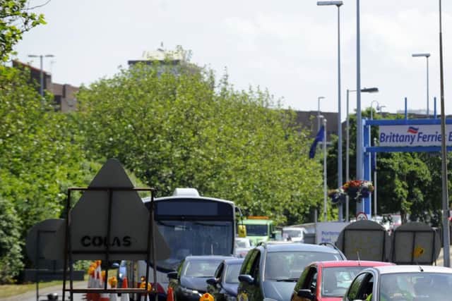 Cars queue in front of the Rudmore roundabout