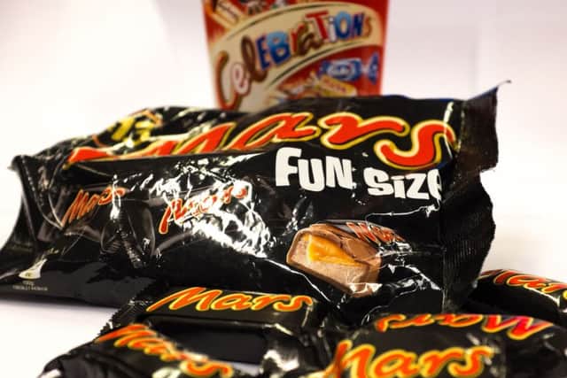 A general photo of a 'fun size' pack of Mars bars and a box of Celebration chocolates, as the confectionery giant has recalled some of its most popular chocolates in the UK after a piece of plastic was found in one of its products.
Picture: Stefan Rousseau/PA Wire