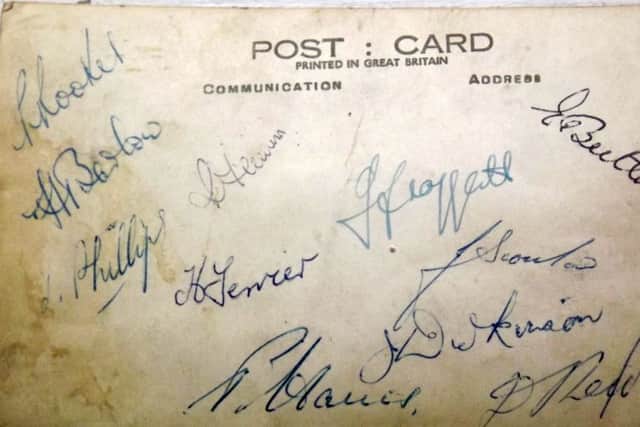 The reverse of the card  signed by all the team.