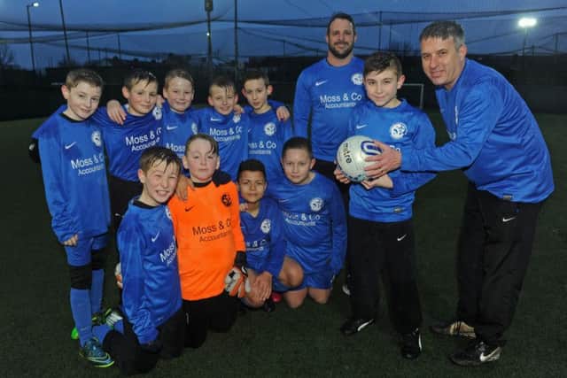The Fleur de Lys Nelson under 11 football team, with manager Paul Urry, right, coach Darren King and, holding the ball, Noah's brother Harry, 10
Picture: Ian Hargreaves (160182-2)