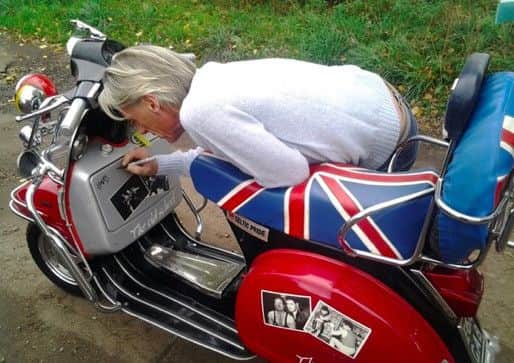 Paul Weller signs the Vespa