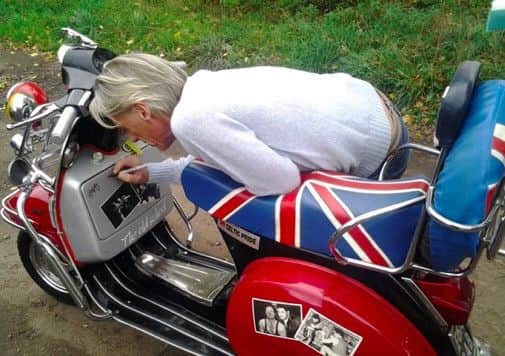 A 1988 Vespa 125 Sport scooter, signed by The Modfather Paul Weller, will be auctioned at Goodwood