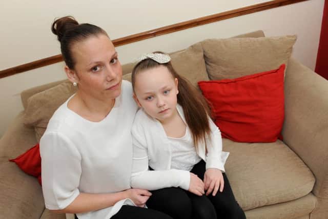 Ruby Higgs with her mum Stacey Hawes. Ruby hurt her mouth after biting into an earring that had fallen into her pizza Picture: Sarah Standing (160451-4612)