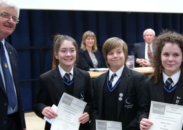 From left: Fareham Meon Rotary Club Vice-President Graham Lawrence with Charlotte Plummer, Thomas Anderson and Teghan Neat from Fareham Academy