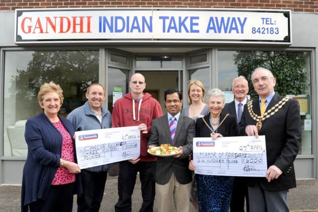 From left, pictured last year, are Doreen Allen, collecting money for Cancer Research UK on behalf of Timothy Haimes, landlord of The Heathfield Arms who ran the London Marathon; Paul Richards from Richards Newsagents; cancer patient David Bell from Fareham; owner of Gandhi's Abu-Suyeb Tanzam; Amanda Mahoney from The Rowans Hospice; The Mayoress of Fareham Pamela Norris; Cllr Leslie Keeble and the then Mayor of Fareham Cllr David Norris
Picture: Sarah Standing (150788-8154)