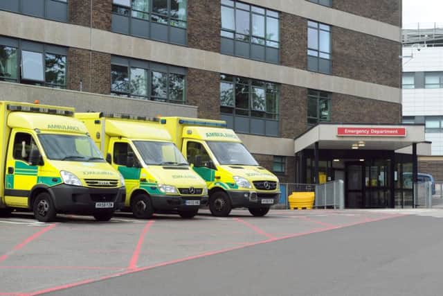 Ambulances at QA Hospital's emergency entrance