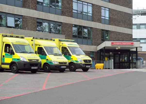 Ambulances at 

QA Hospital's emergency entrance