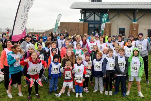 Youngsters from Ditcham Park School warm up  at the Race for Rowan Picture: Allan Hutchings (160376-338)