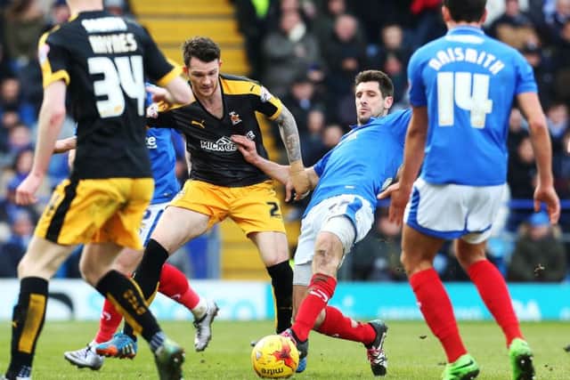 Danny Hollands in the thick of the action on his return to the Pompey starting XI