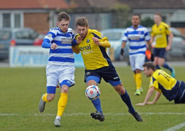 Gosport Borough defender Rory Williams. centre, right, battles for the ball with an Oxford City opponent in Saturday's 0-0 draw   Picture: Ian Hargreaves