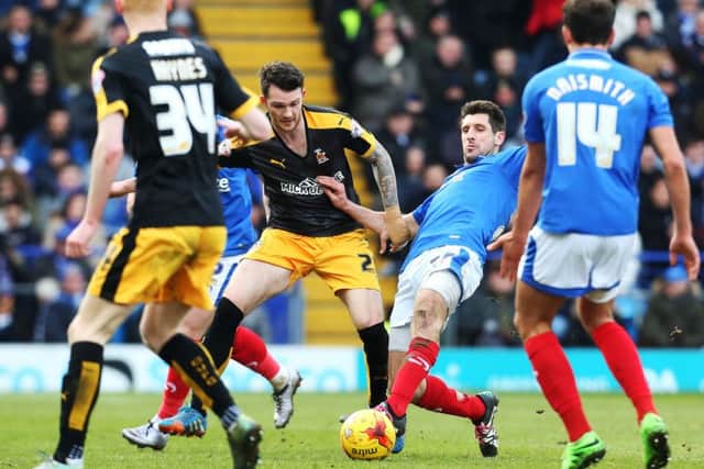 Danny Hollands battles with James Spencer. Picture: Joe Pepler