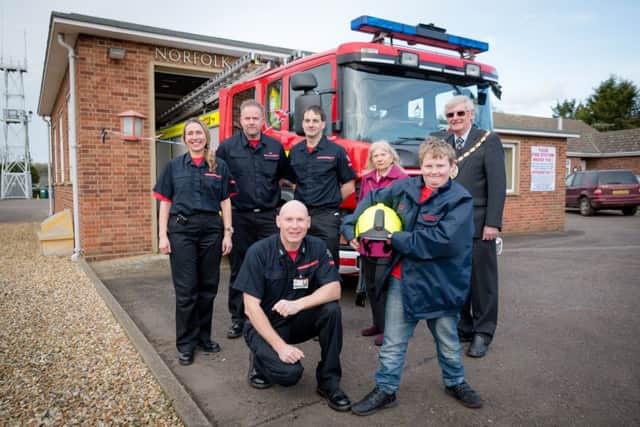 Andrew Impey (10) stops at Heacham Fire Station on his mission to visit every Station in the land. Greeting him is Watch Manager Barry Rudd with Back LtoR, Firefighters Leesa Espley, Damon Heffer, Chris Wood and Borough Mayor and Mayoress Colin and Julie Manning. ANL-160221-212245009