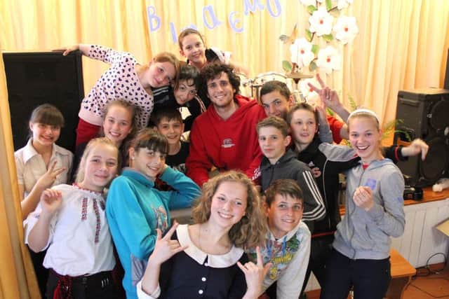 Quinn Boylan with children in Ukraine
Picture: Philip Bradshaw