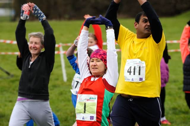 Angela Agate (in red) warming up  (160376-003)