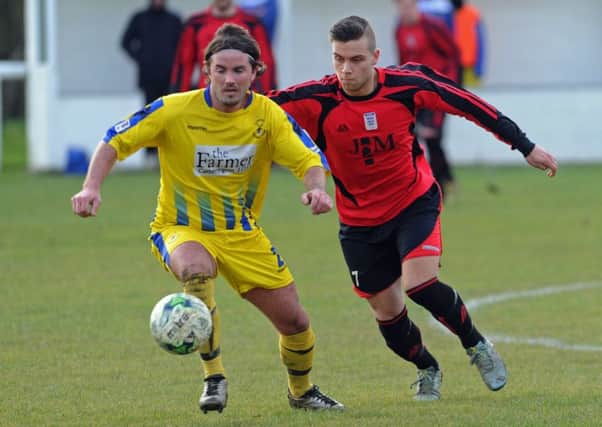Fleetlands and Clanfield, yellow, battle it out in the Hampshire Premier League senior divison   Picture: Ian Hargreaves