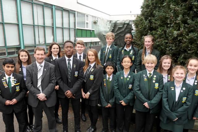 St Edmund's Catholic School in Portsmouth, has received a 'outstanding' Ofsted report. Headteacher Simon Graham is pictured with students at the school 
Picture: Sarah Standing (160462-5528)