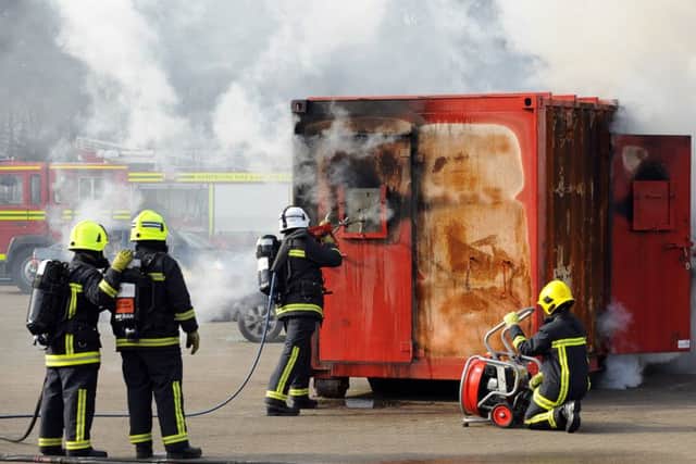 A fire crew demonstates the use of new equipment