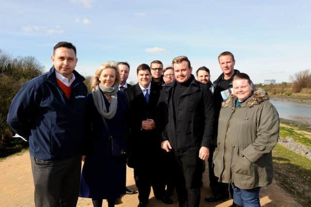 Secretary of State for Environment Food and Rural Affairs Liz Truss MP with coastal defence partnership manager  Lyall Cairns, left, and second from right, Cllr Rob New Picture: Sarah Standing (160457-5013)