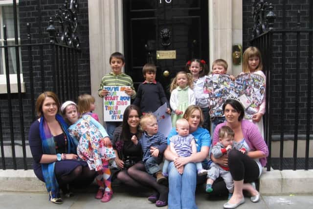 Protesters who were campaigning to save Sure Stsart cenrtes in Hampshire in 2011, pictured in outside Number 10 Downing Street