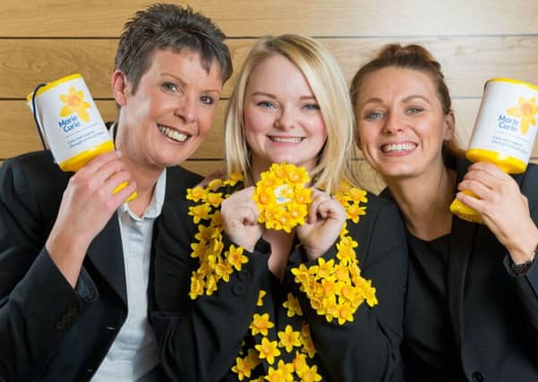(L-r) Yorkshire Building Society colleagues Chris King, Kayleigh Batty and Lizzie Jones are backing the 'get behind the daffodil' fundraiser.      Photograph by Richard Walker/ www.imagenorth.net
