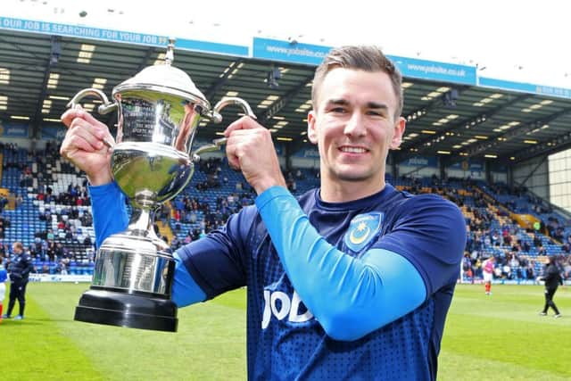 Jed Wallace lifts the Pompey player of the season trophy for 2014-15. Picture: Joe Pepler