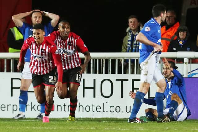Pompey players can't hide their frustration as Ollie Watkins celebrates his late leveller. Picture: Joe Pepler