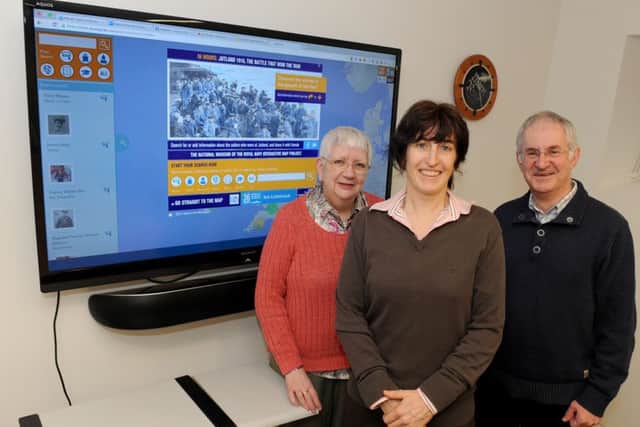 Digital manager Casey Keppel-Compton, centre, with Carole Chapman and Steve Doe from Portsdown U3A, next to the Battle of Jutland Interactive Map Picture: Sarah Standing (160460-5210)