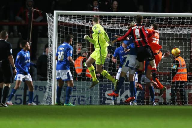 Keeper Barry Roche scores for Morecambe against Pompey. Picture: Joe Pepler