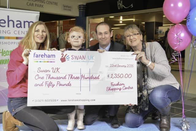 Krista Ford with her daughter Isie, Fareham shopping centre manager Mike Taylor and Sylvie Hasson the centre administrator.
Picture: Adam Rivers