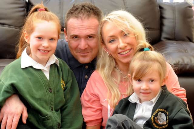 Clare Brown with her husband Chris and her children, Alexcia, six, and Savanna, five. ks1600058-4 SUS-160203-084231008
