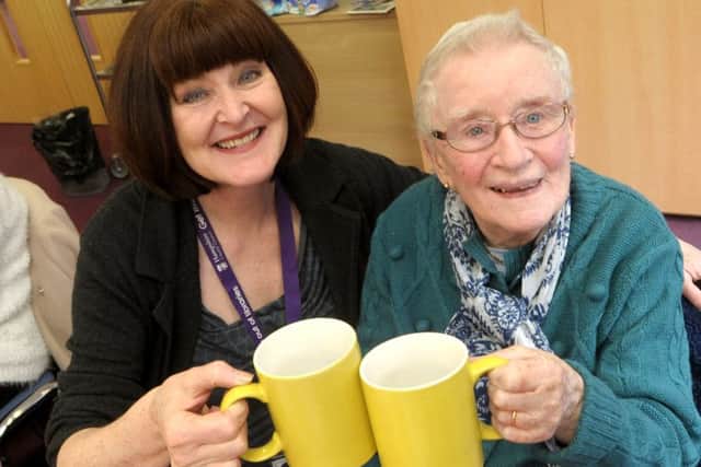 Fareham Saturday Friends club members celebrate the club's first birthday at Fareham Library - Assistant library manager Mandy Watmough, left, shares a drink with Sheila Leader from Havant, who at 91 is the oldest member.  Pic: Mick Young
