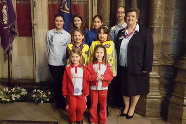 THINKERS Rainbow guides Coral Buckley and Evelyn Cooper (pictured front) at the Baden-Powell memorial in Westminster Abbey