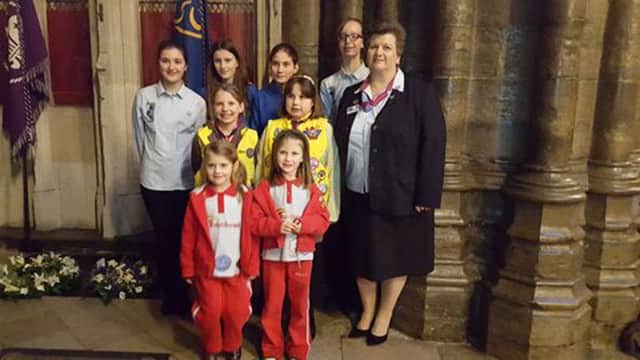 THINKERS Rainbow guides Coral Buckley and Evelyn Cooper (pictured front) at the Baden-Powell memorial in Westminster Abbey