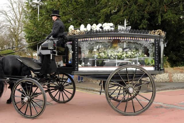 A horse-drawn carriage bore the coffin of Luke Fletcher from the family home to the Church of St Peter and St Paul in Wymering Picture: Malcolm Wells (160304-9509)