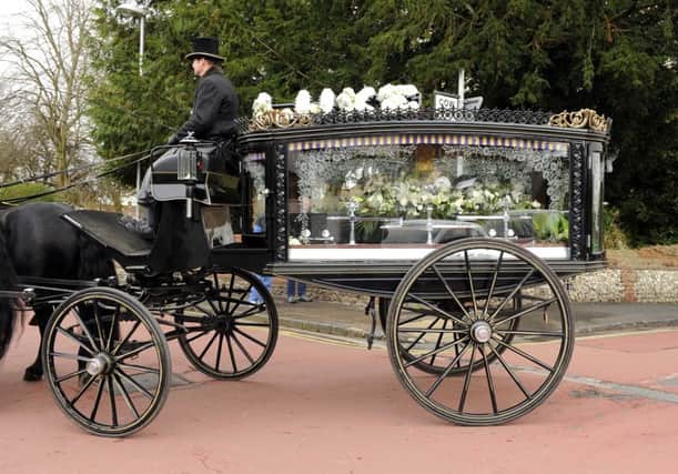 A horse-drawn carriage bore the coffin of Luke Fletcher from the family home to the Church of St Peter and St Paul in Wymering 

Picture: Malcolm Wells (160304-9509)